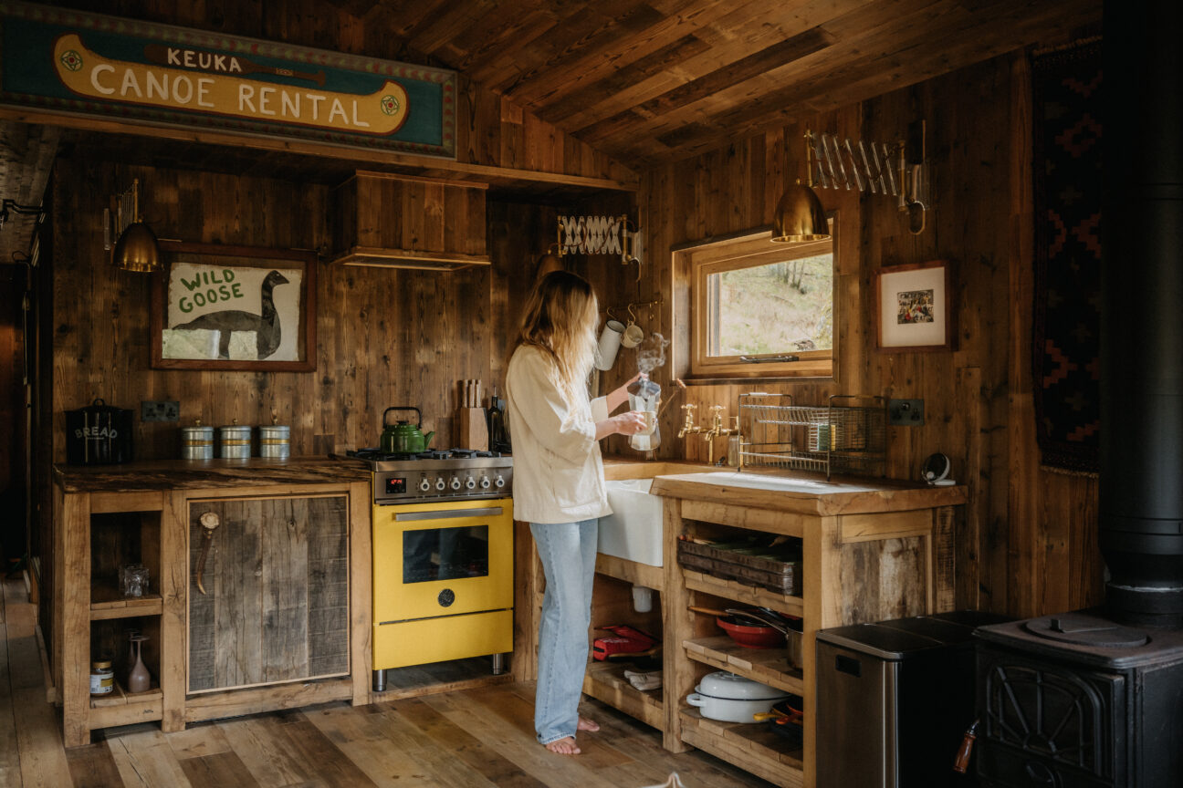 Woman making coffee in kitchen