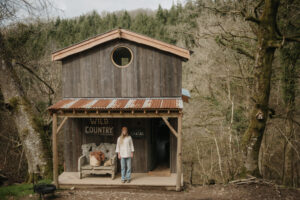 Woman standing outside Chatan, Devon